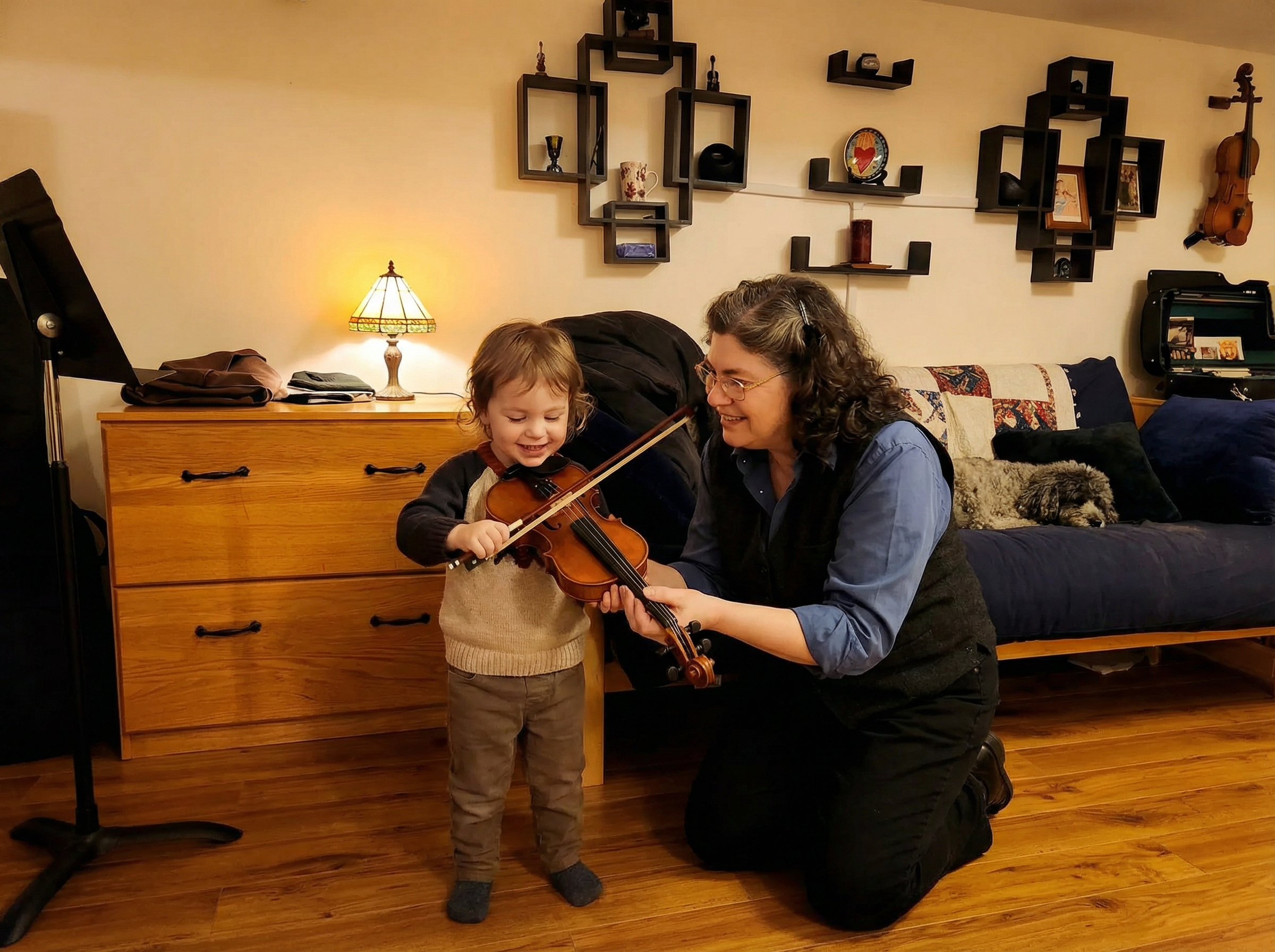 Melissa teaching a young student violin in her studio